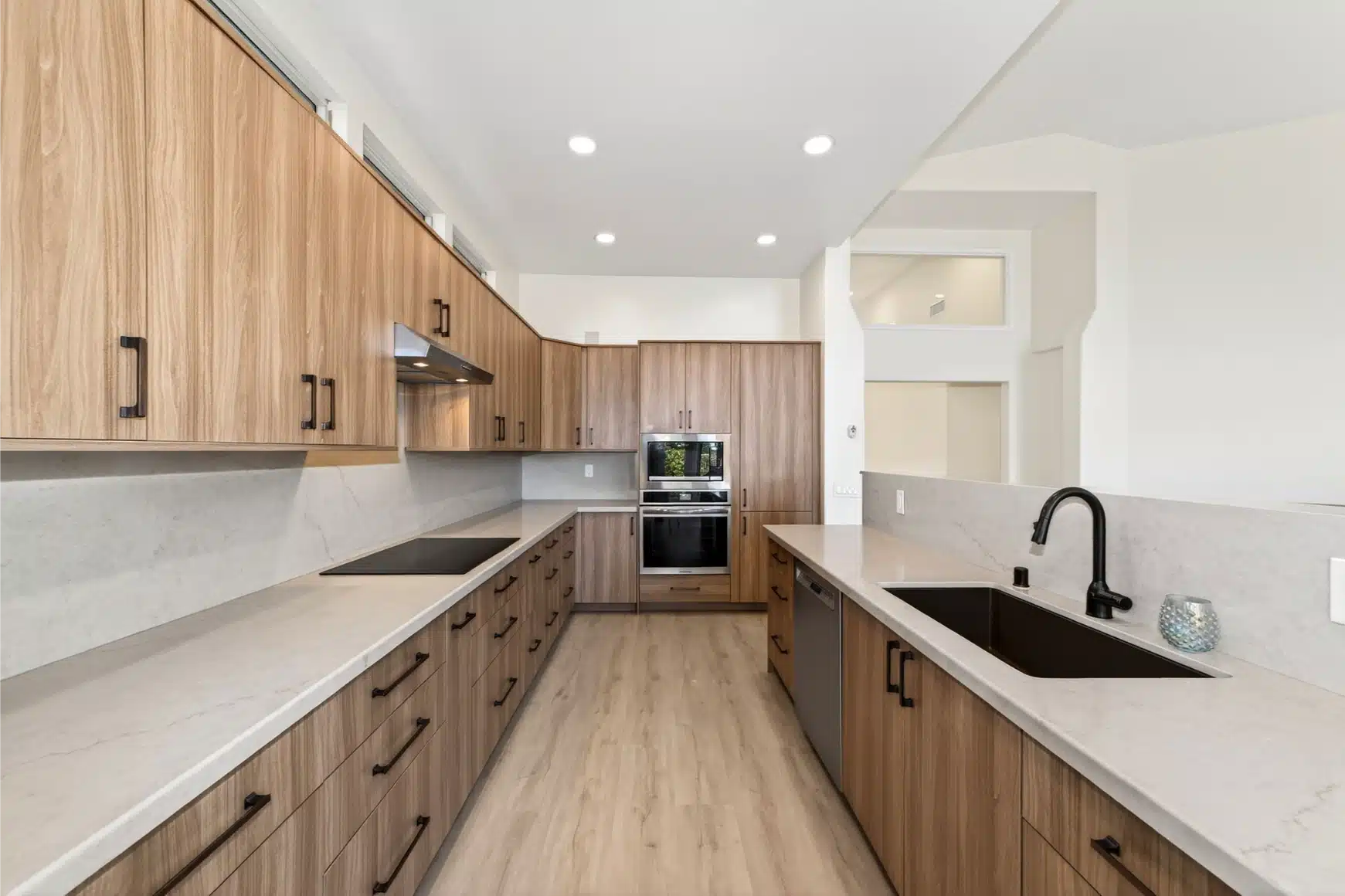 Kitchen remodel by Sheiner Construction in San Diego, with oak cabinetry and quartz counters
