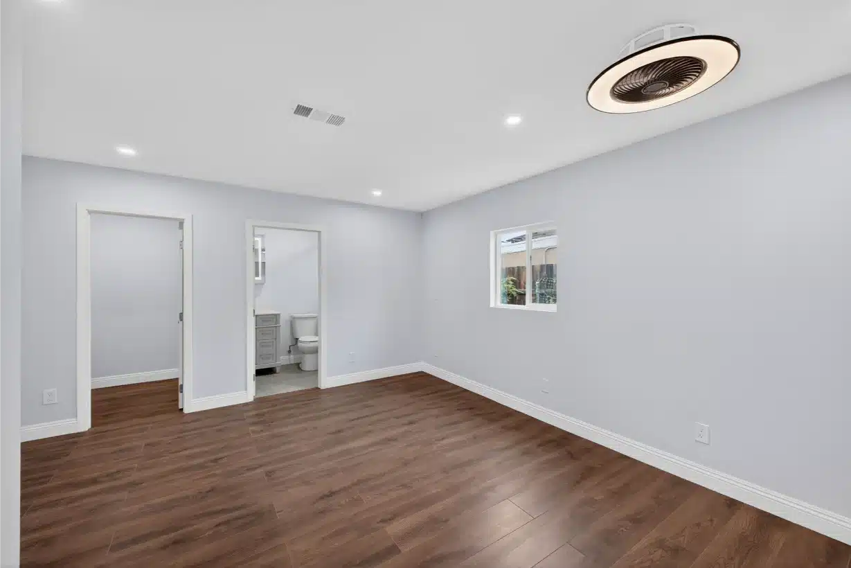 The completed room with new plank flooring and fresh paint
