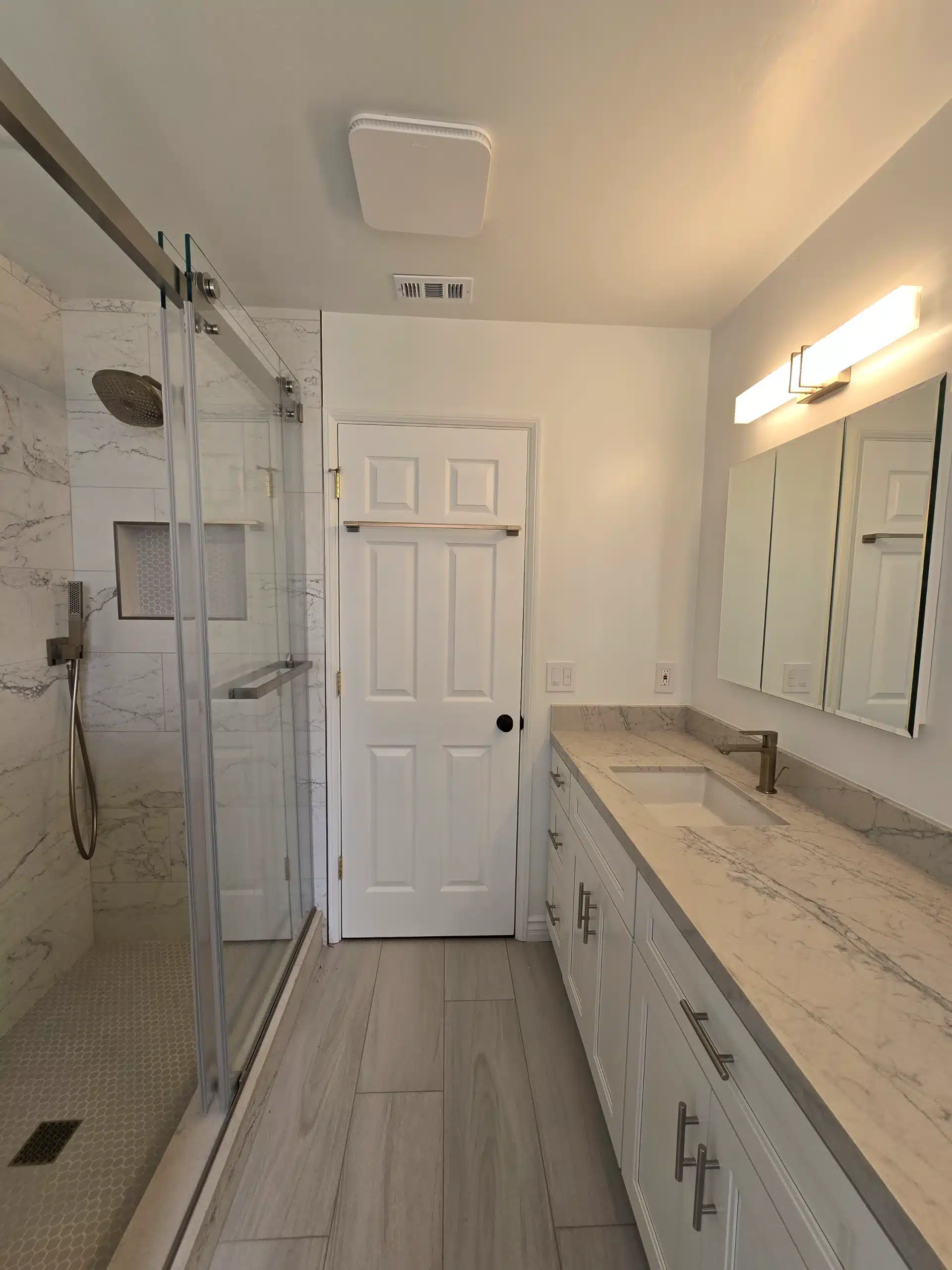 Walk-in shower and vanity in the second Encinitas bathroom