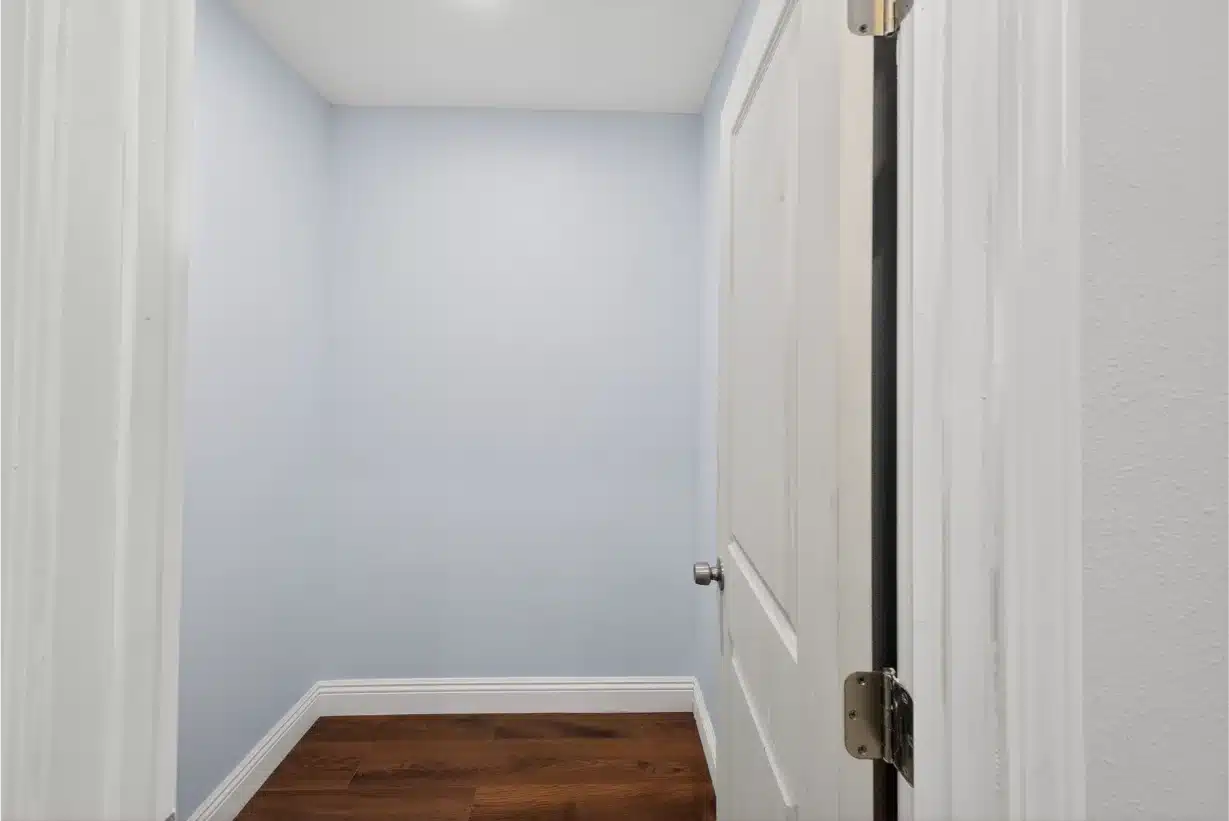 Completed hallway and doorway with new plank flooring