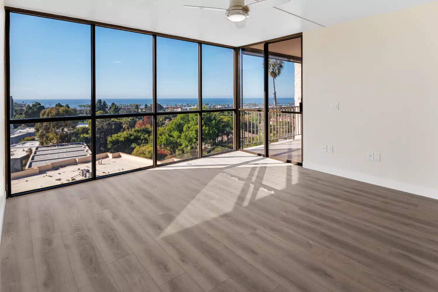 Floor-to-ceiling glazing in the remodelled La Jolla condo, looking out over the coast