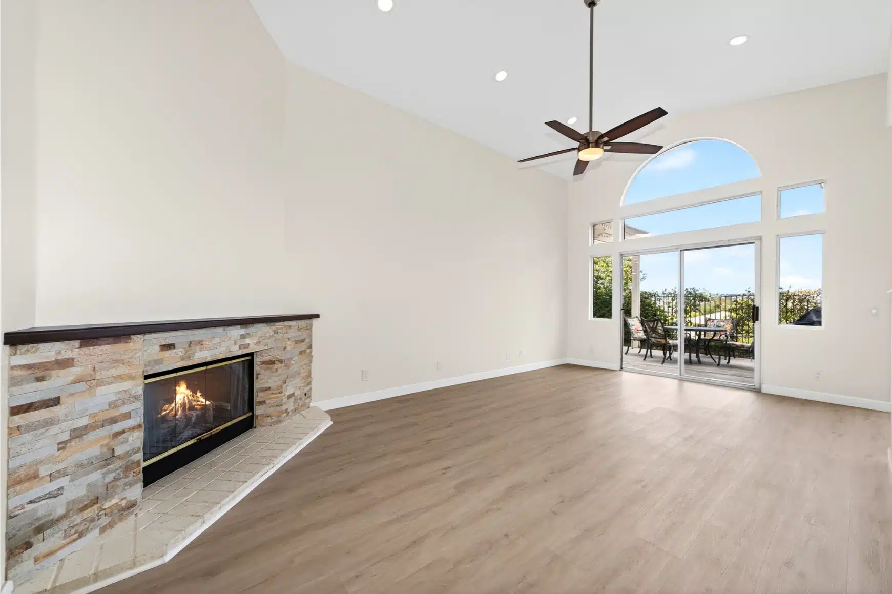Stone fireplace and the open plan beyond it