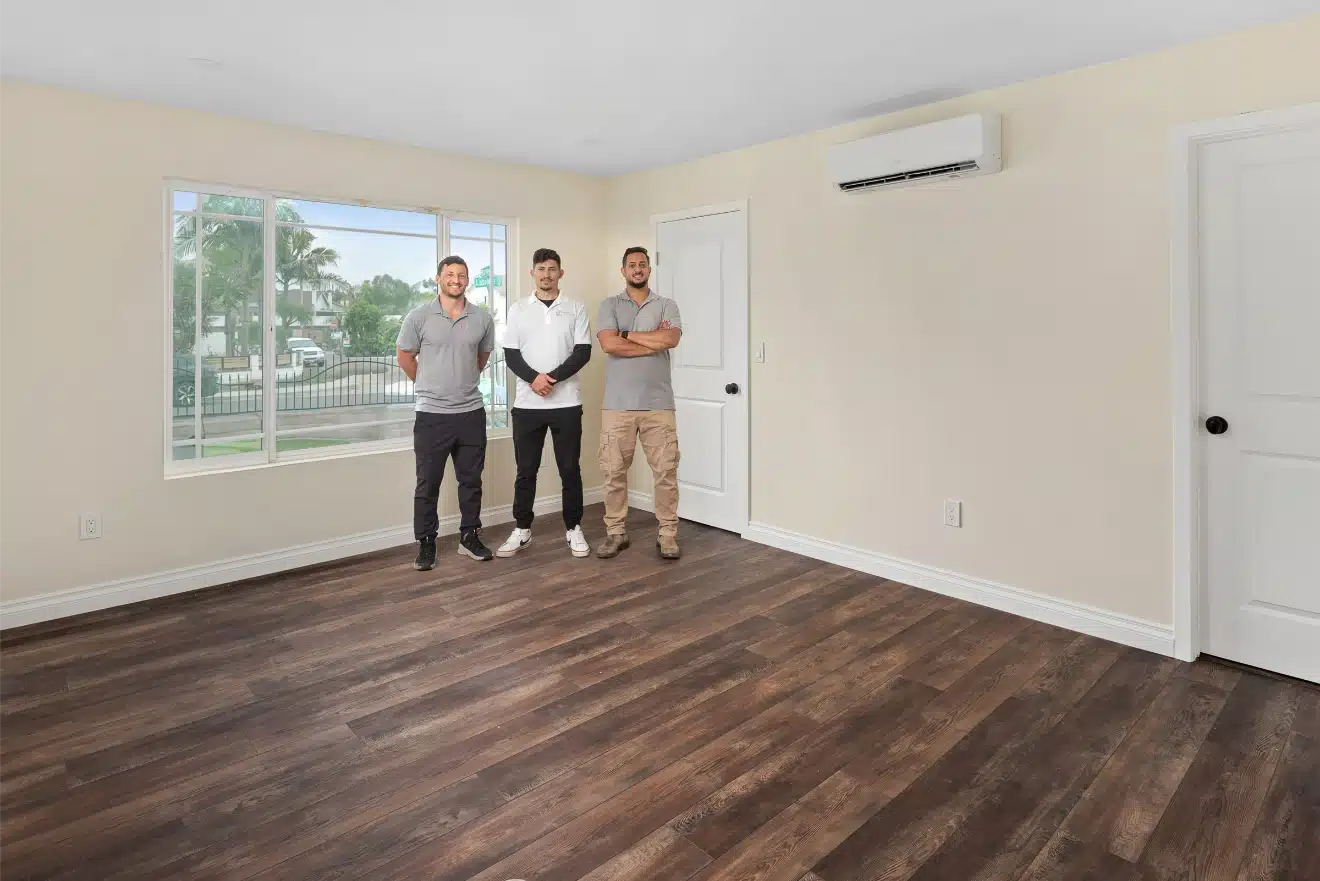 The completed addition interior with plank flooring and a wall-mounted mini-split