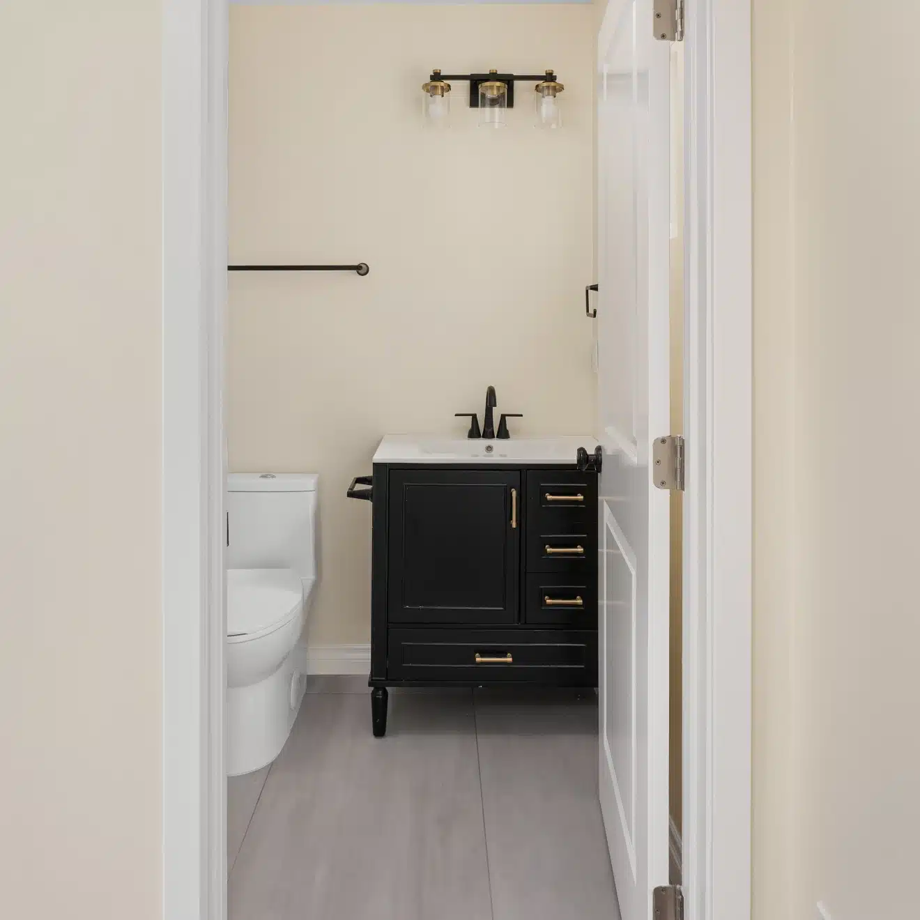 The bathroom from the doorway, showing the vanity and toilet