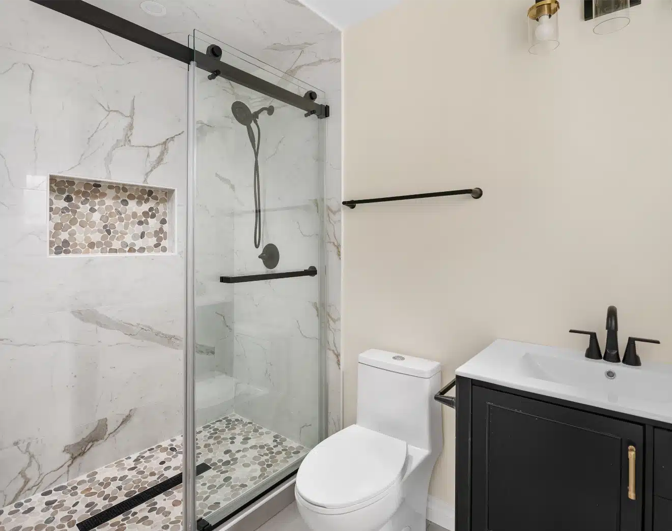 The shower enclosure and vanity from the opposite corner