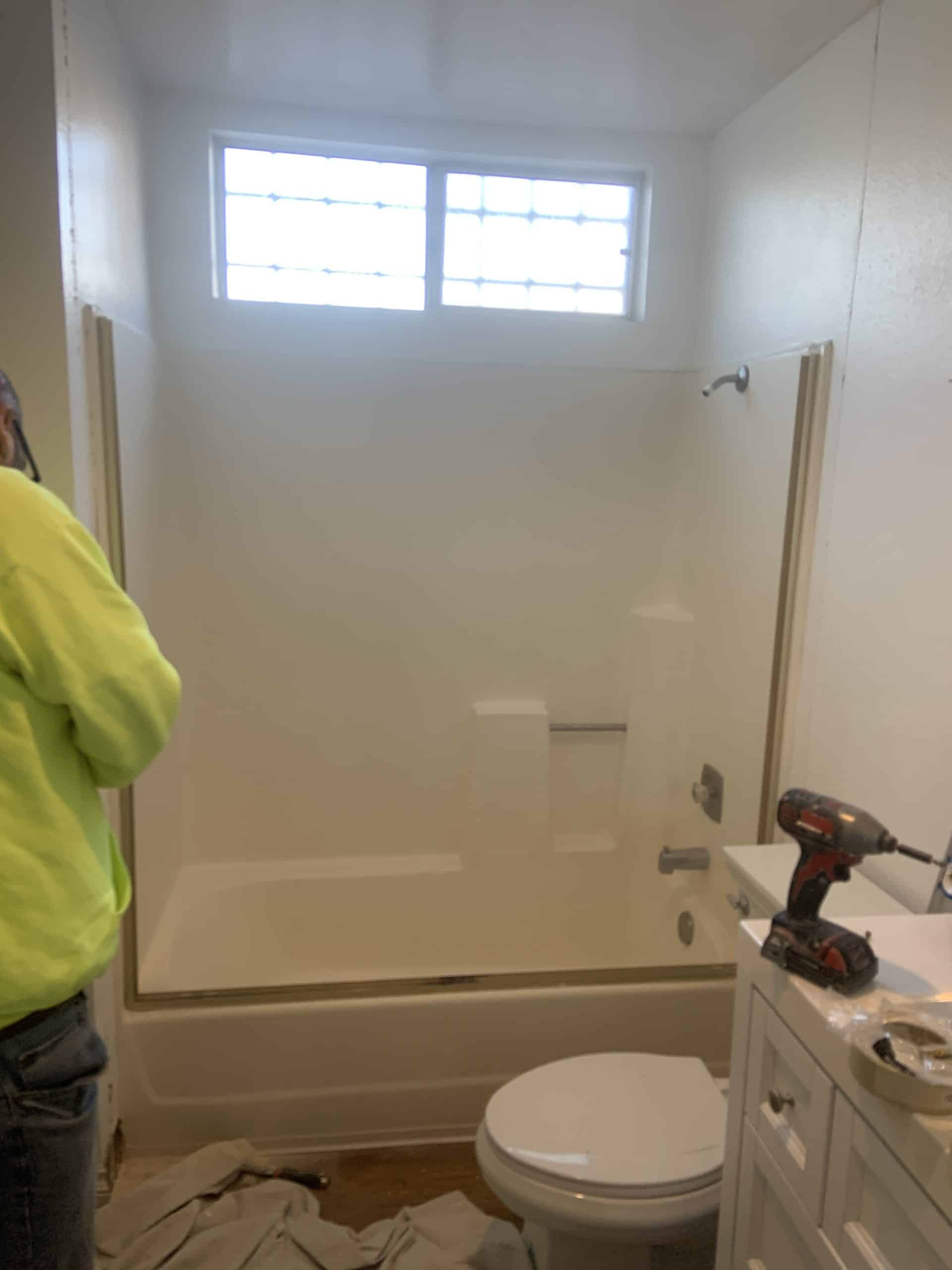 Strip-out underway in the La Mesa bathroom, with the original tub still in place