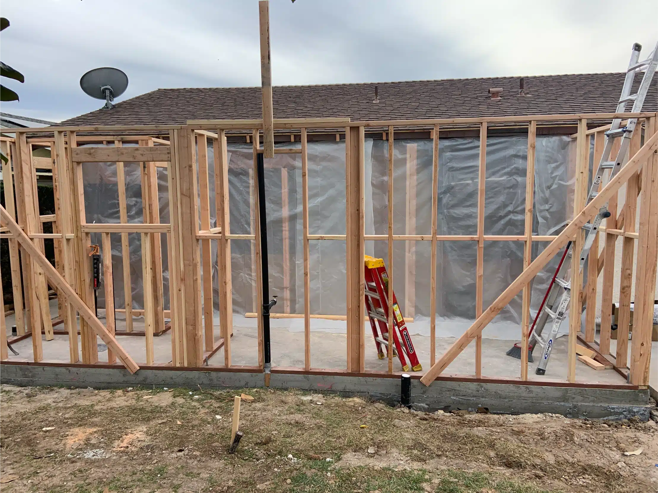 Framing and bracing at the junction with the existing house