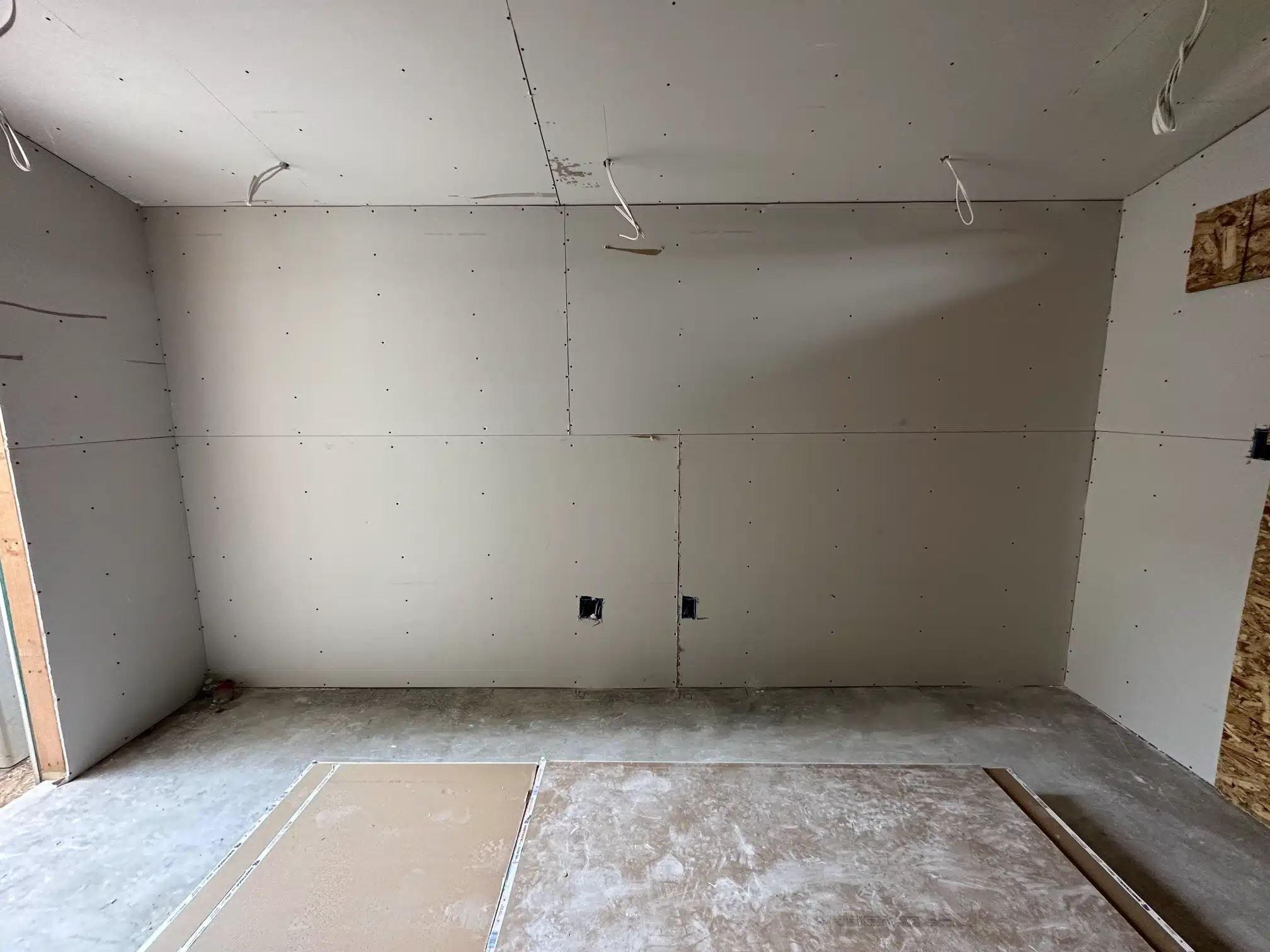 The addition drywalled inside, with the subfloor down