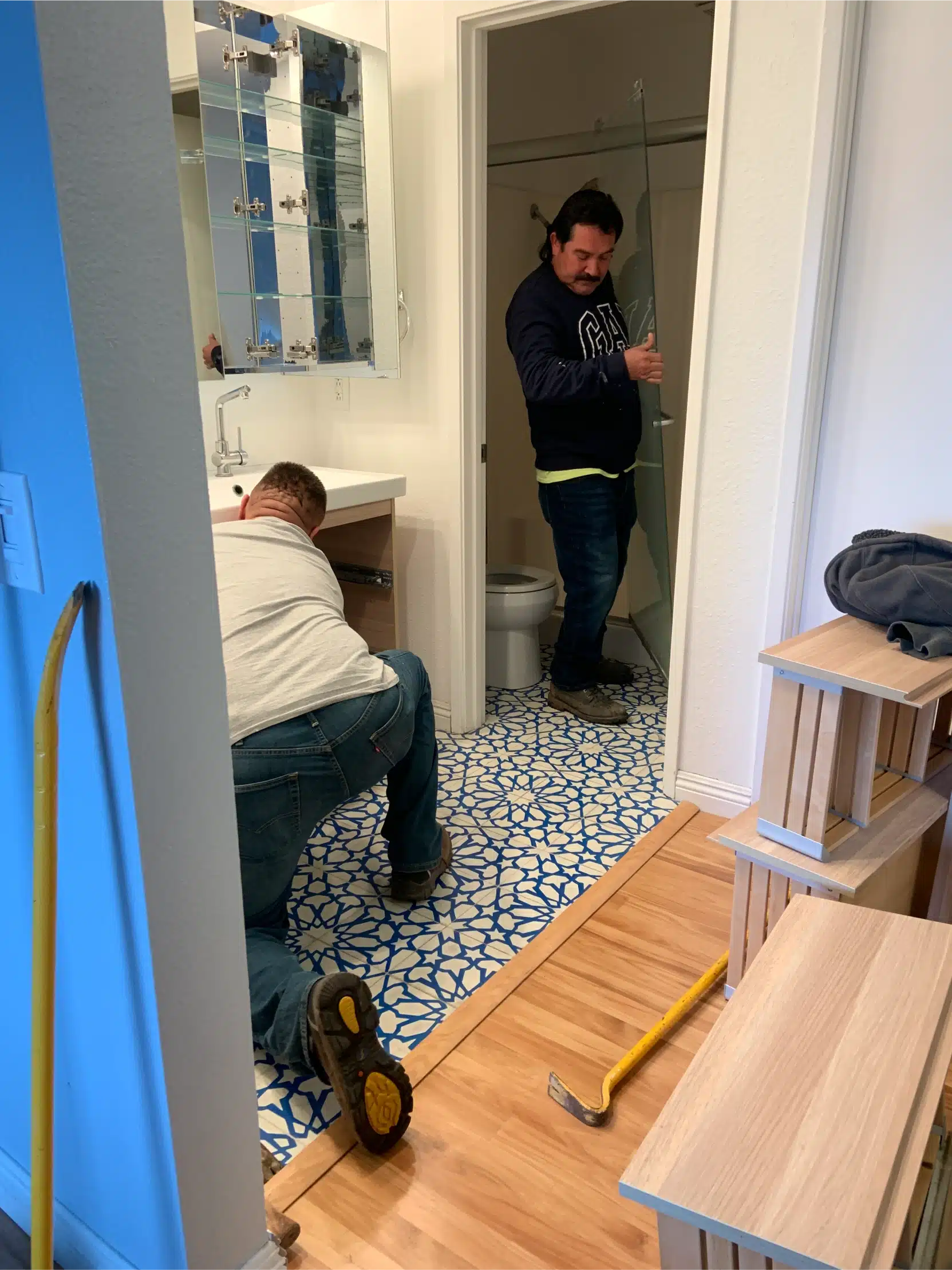 Protected floor and masked surfaces while the vanity wall is worked on