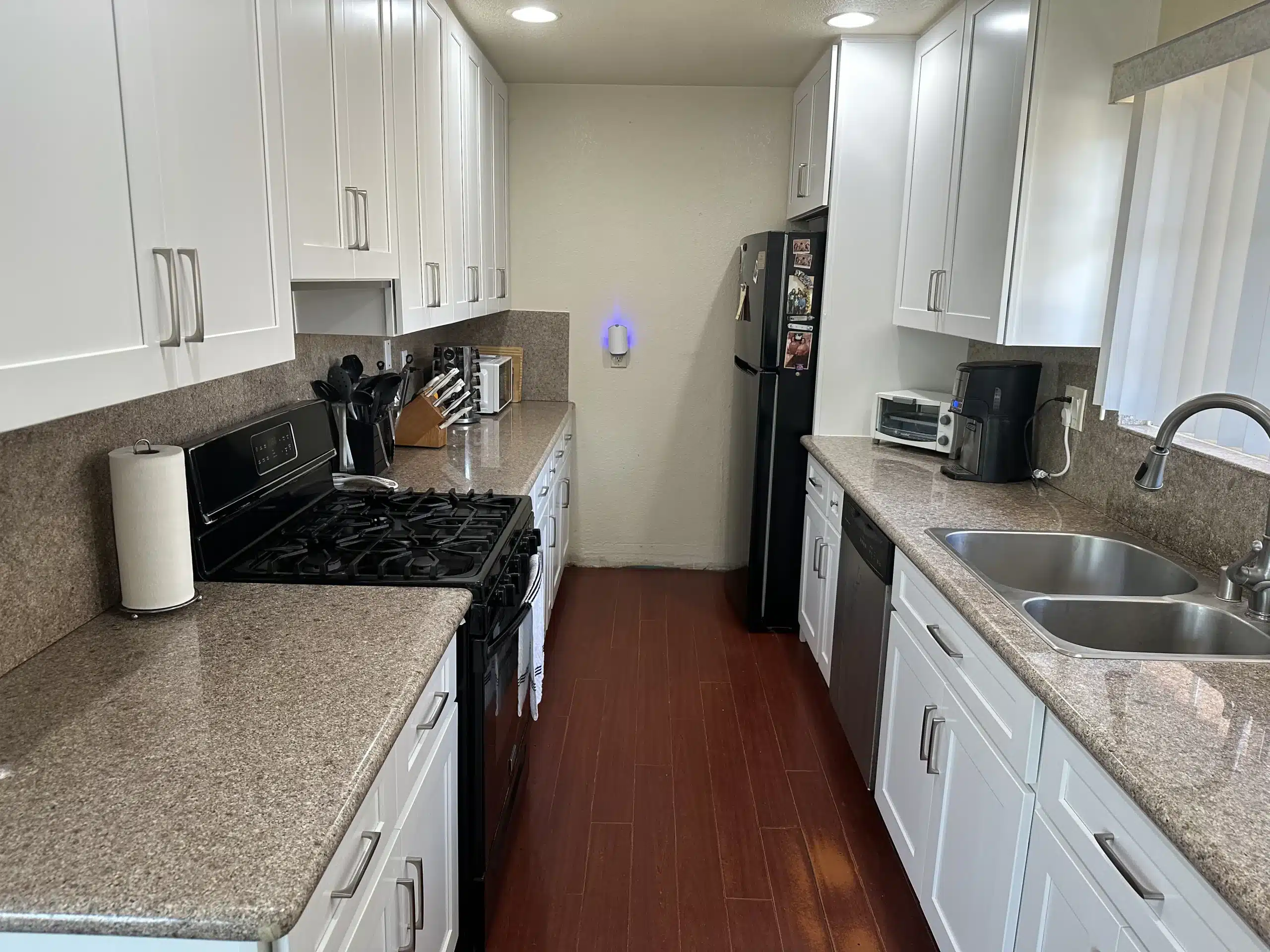 Completed kitchen run with the gas range and tile backsplash