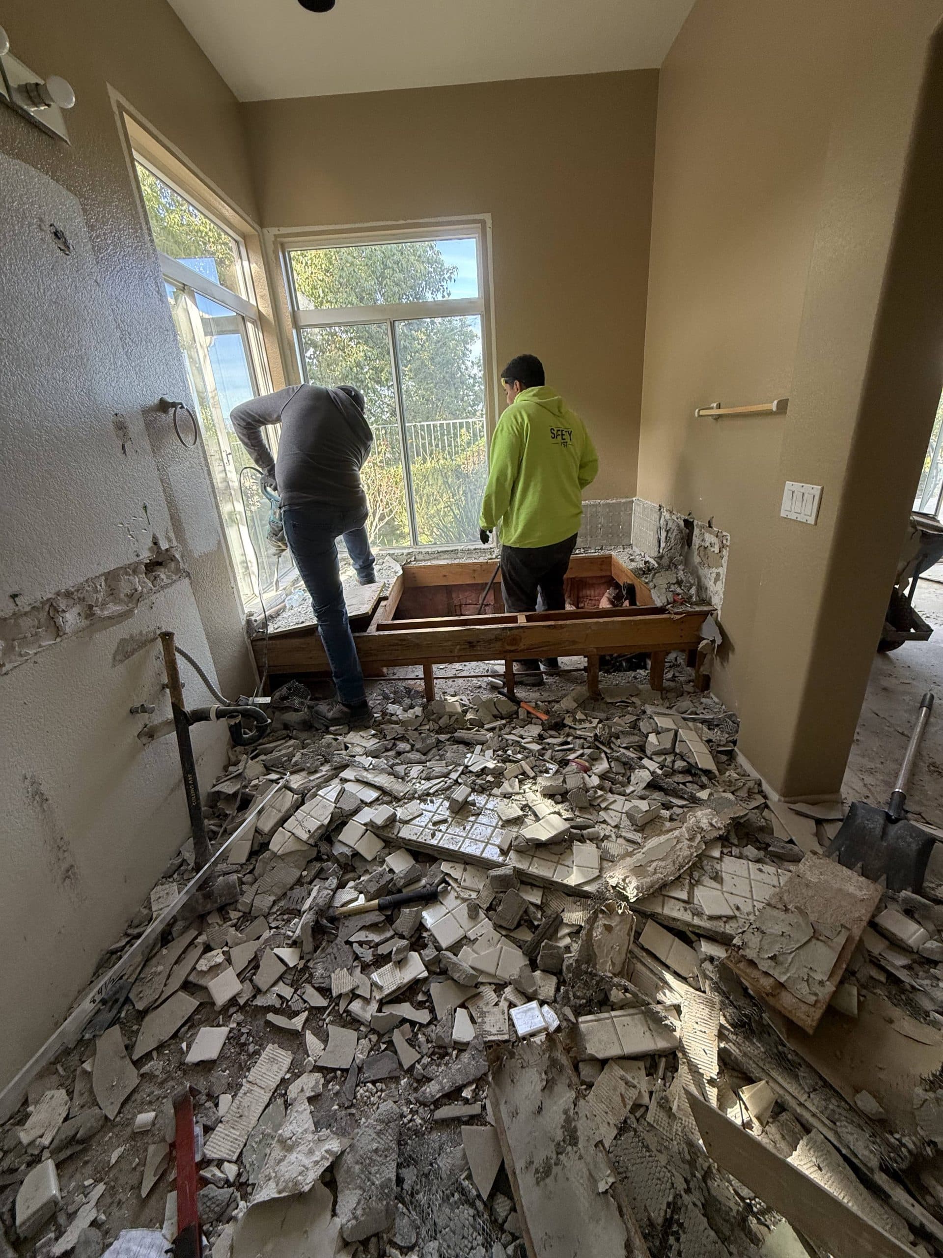 Demolition underway with the original tile broken out