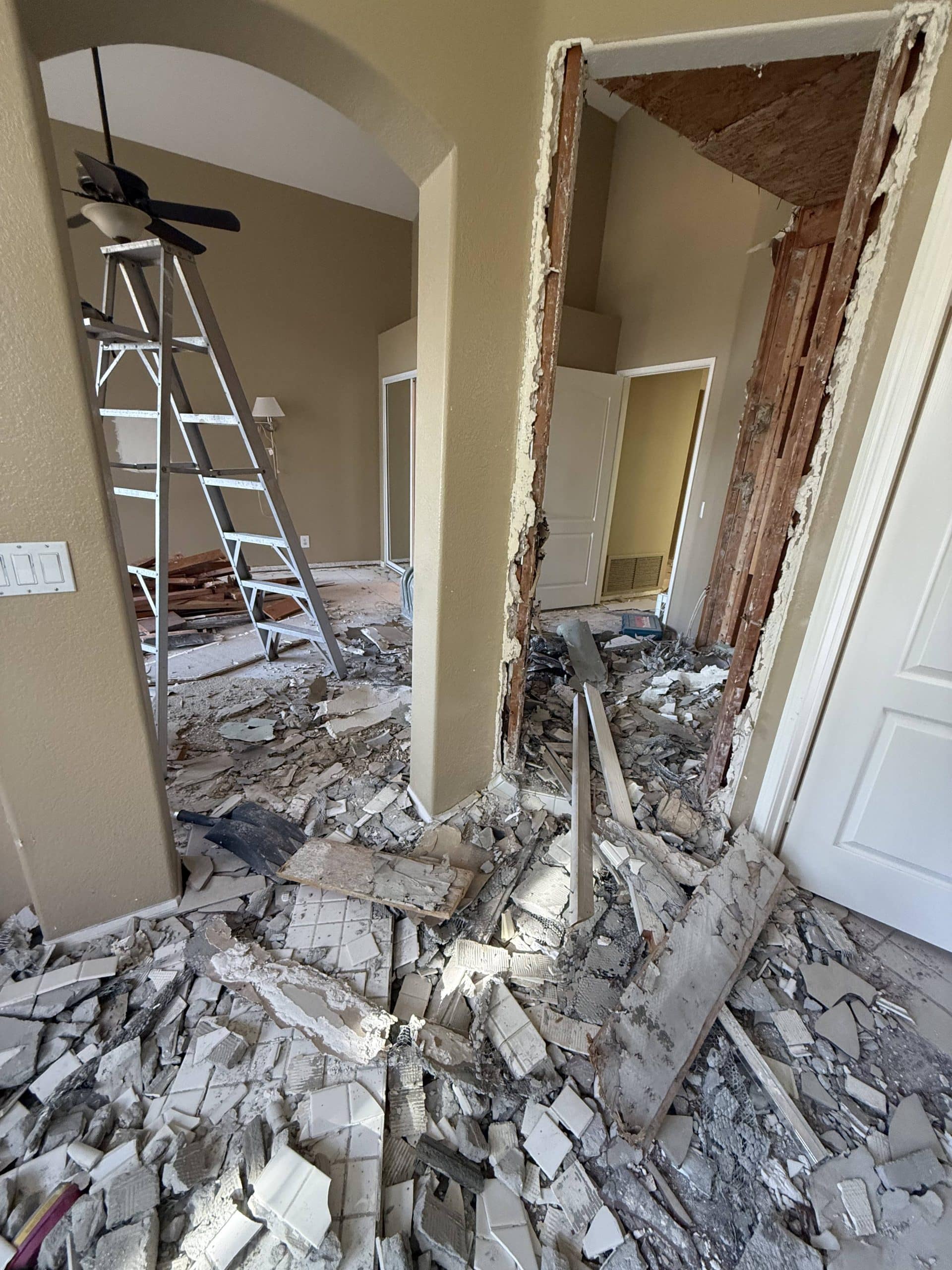 The original fireplace and surround being taken out during demolition
