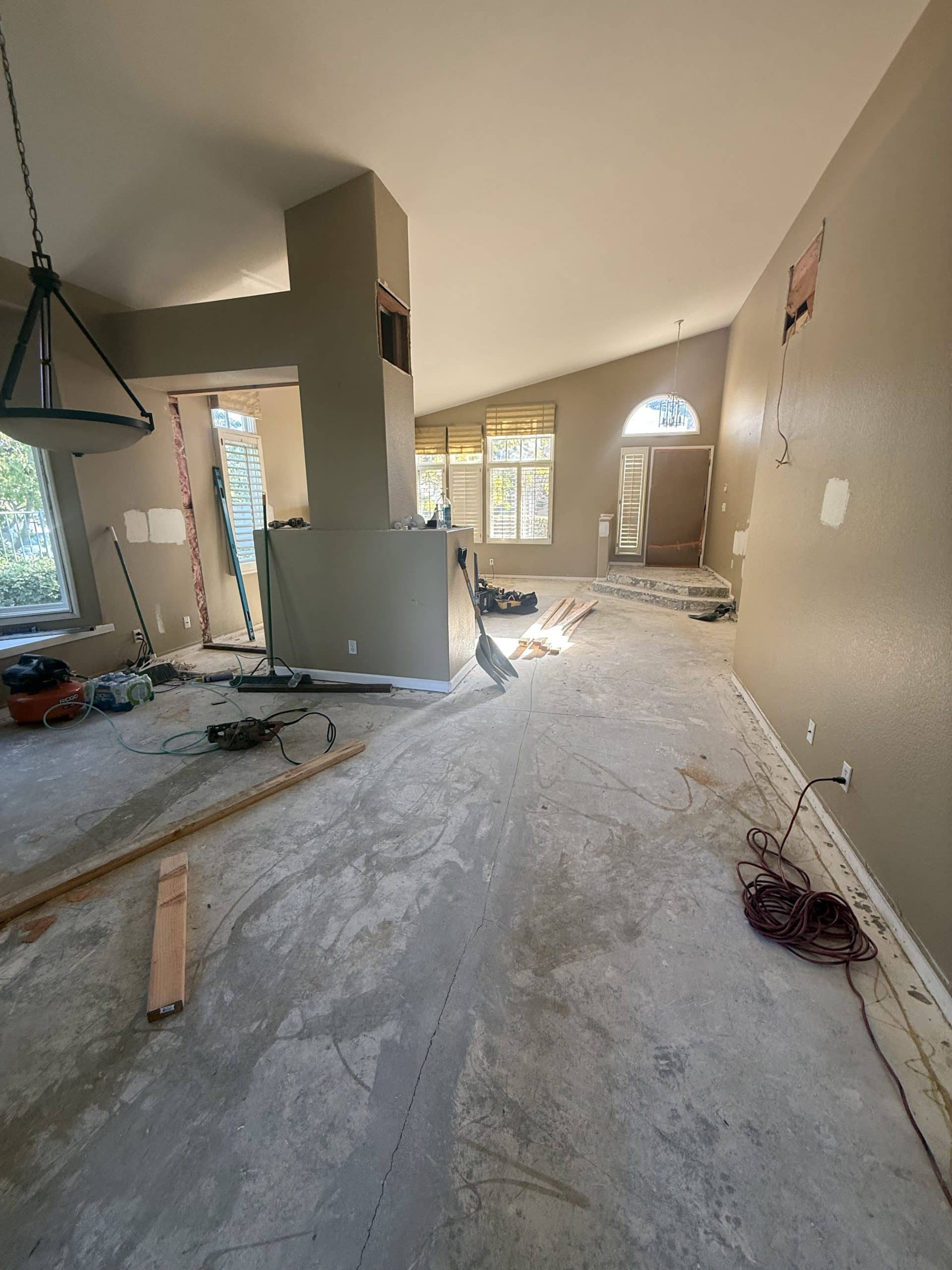 The vaulted living space stripped to the slab before rebuilding