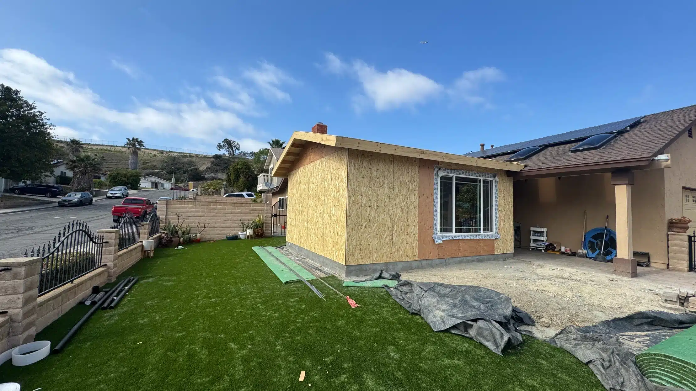 The new addition sheathed and standing alongside the existing Paradise Hills house