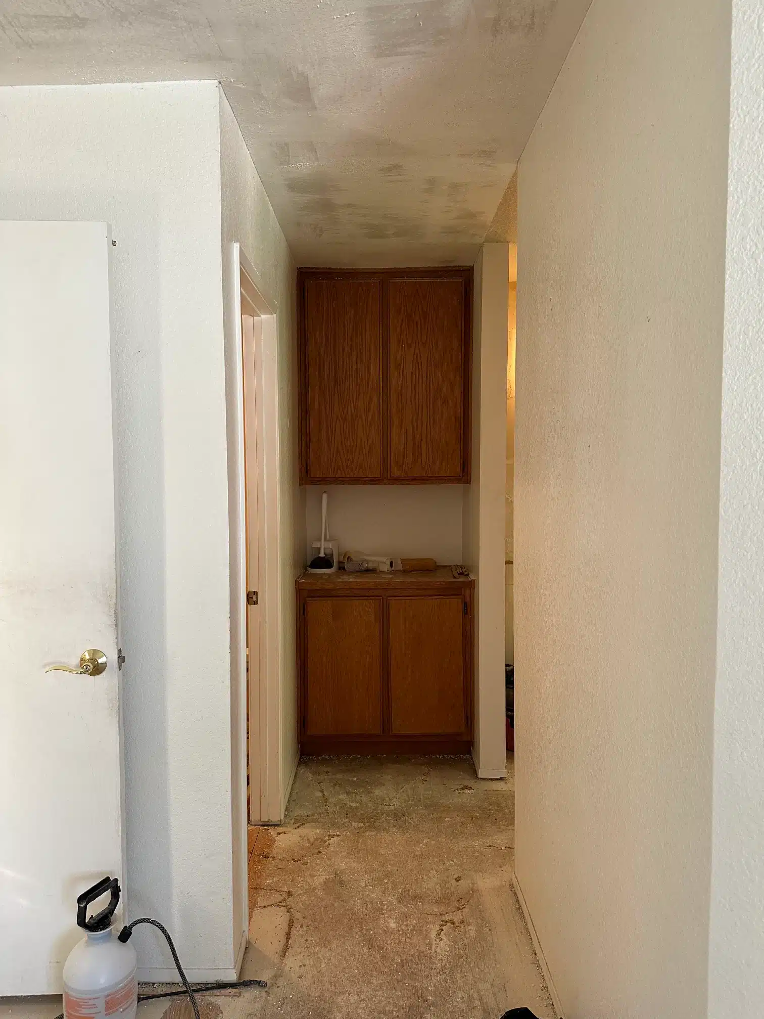 The original kitchen doorway and cabinetry before removal