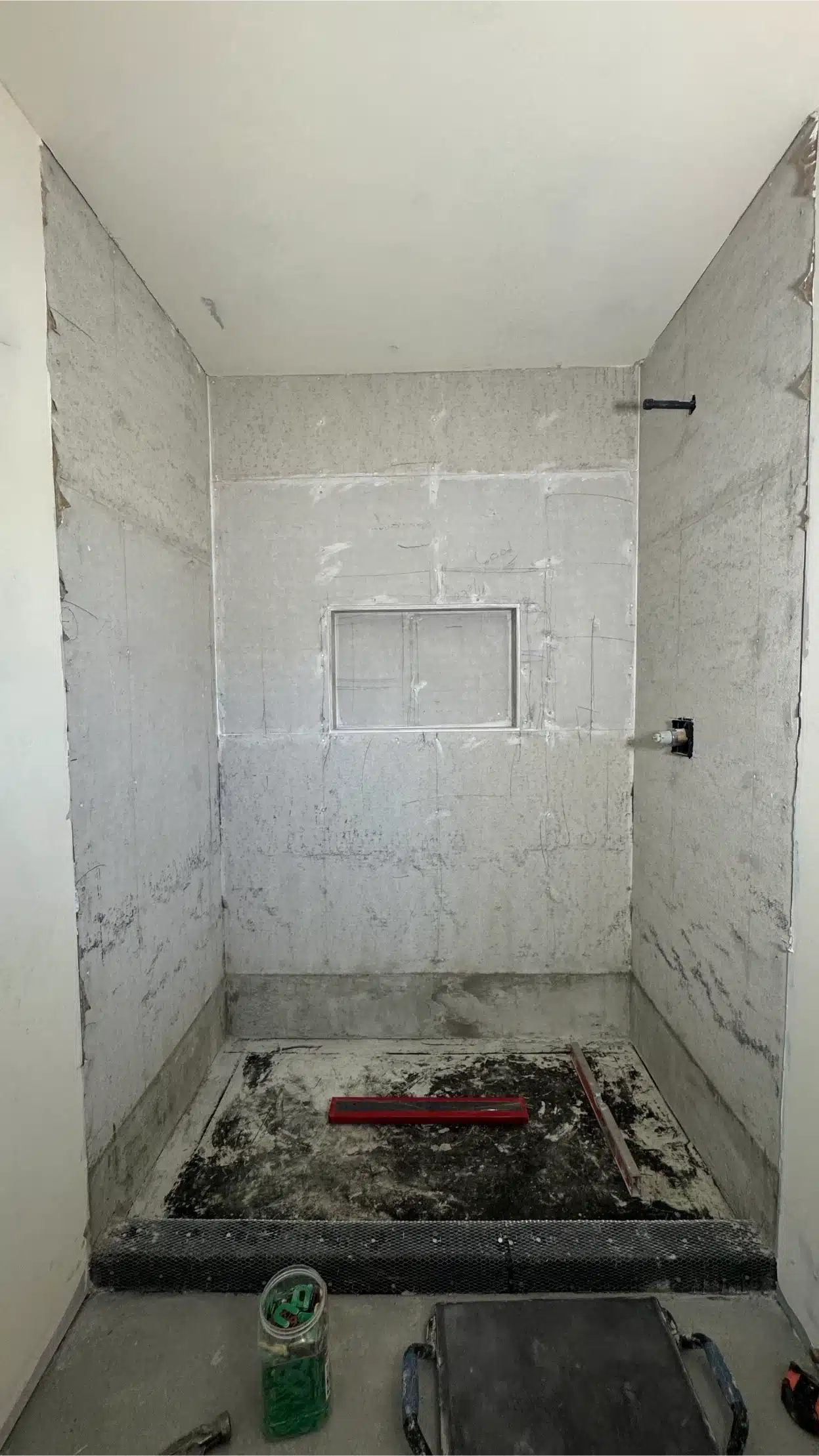 The bathroom taken back to the shower pan and substrate before rebuilding