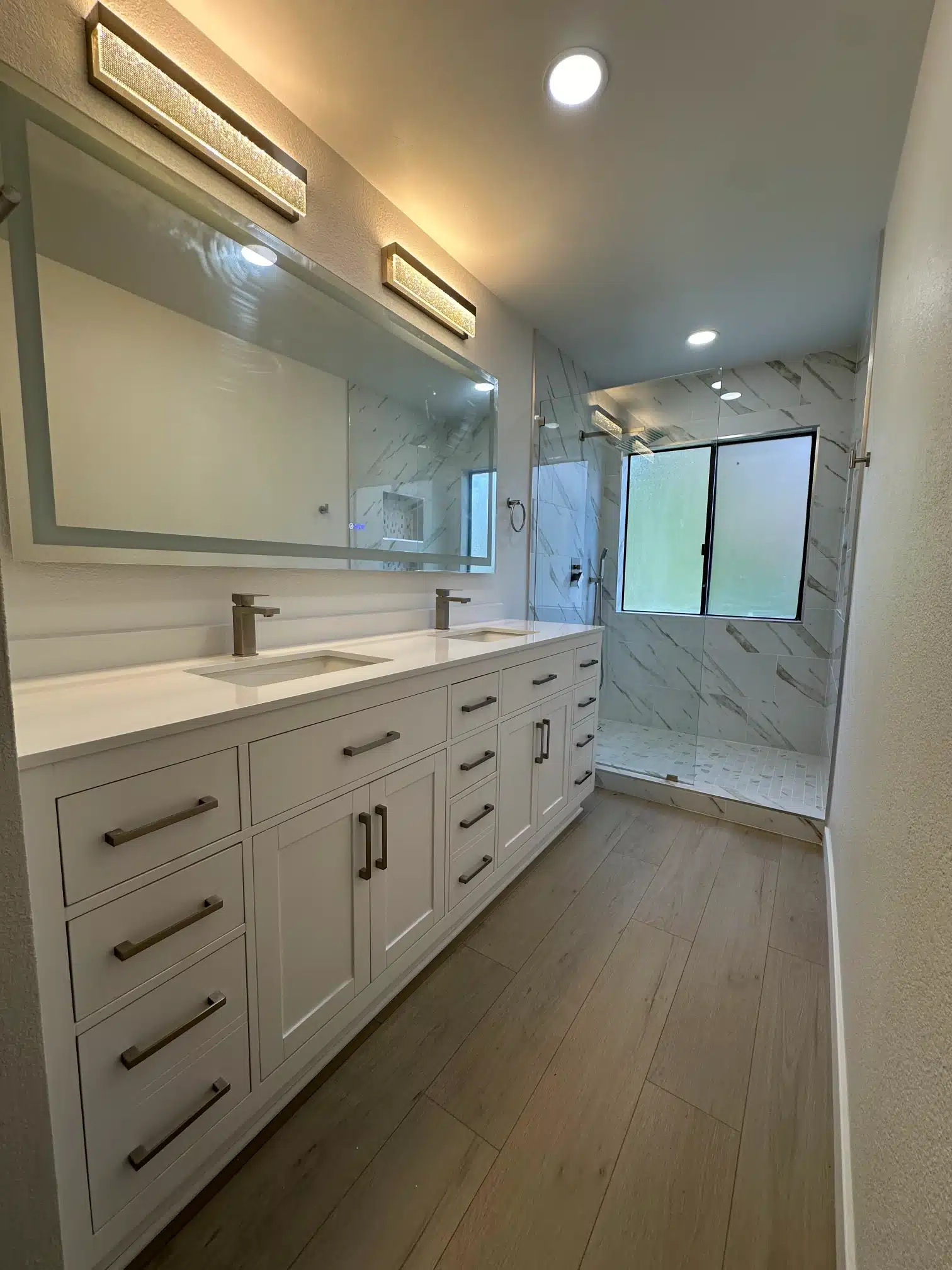 The primary bathroom looking through to the shower