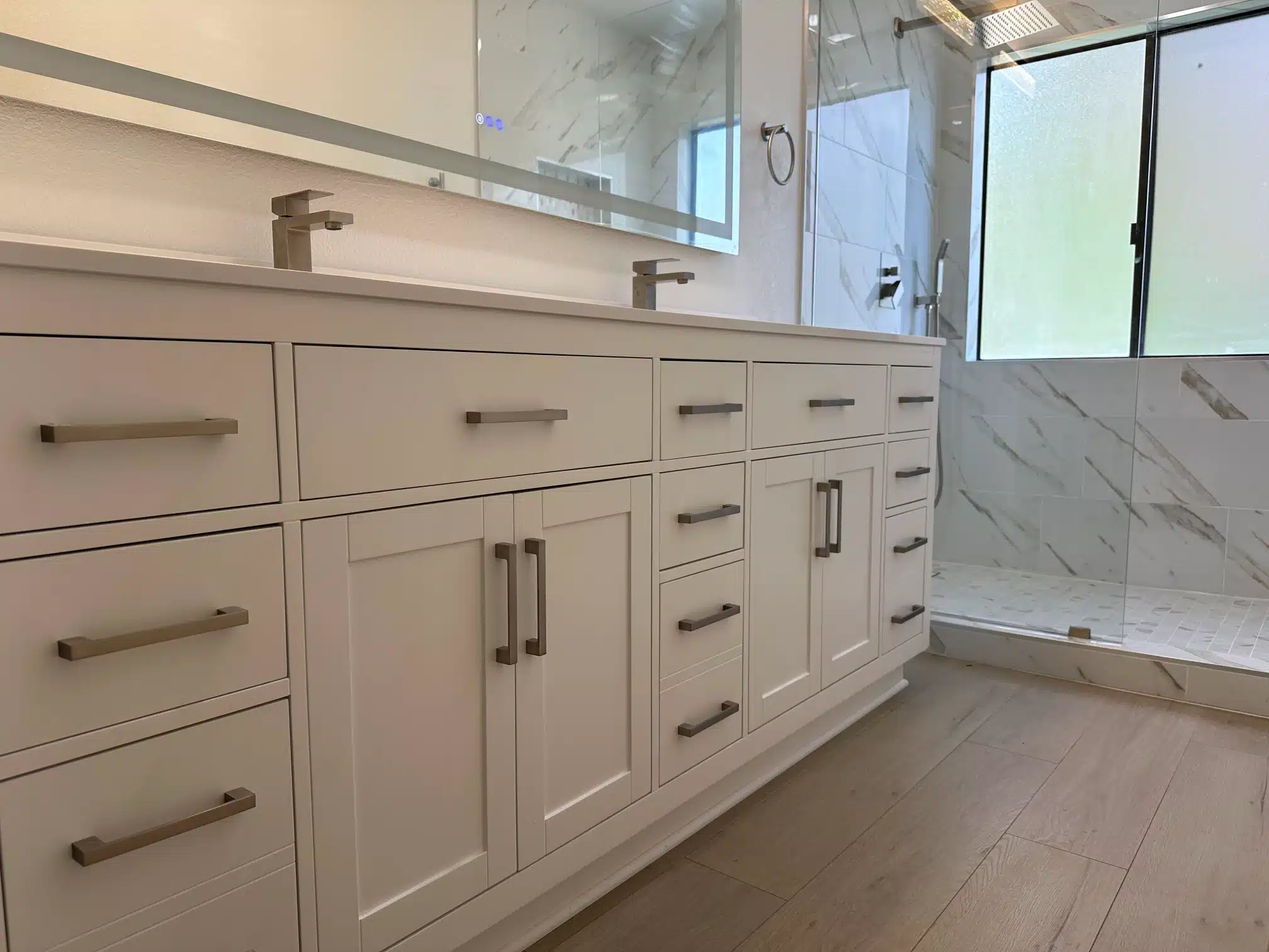 Long vanity run with the glazed shower alongside