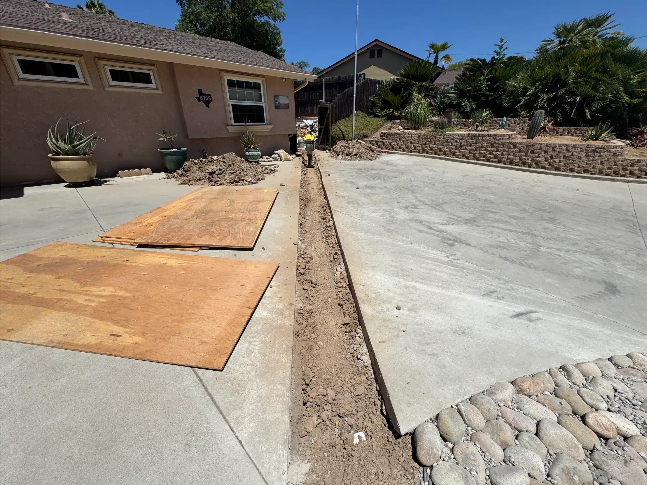The ADU slab poured and cured, with a new walkway to the main house