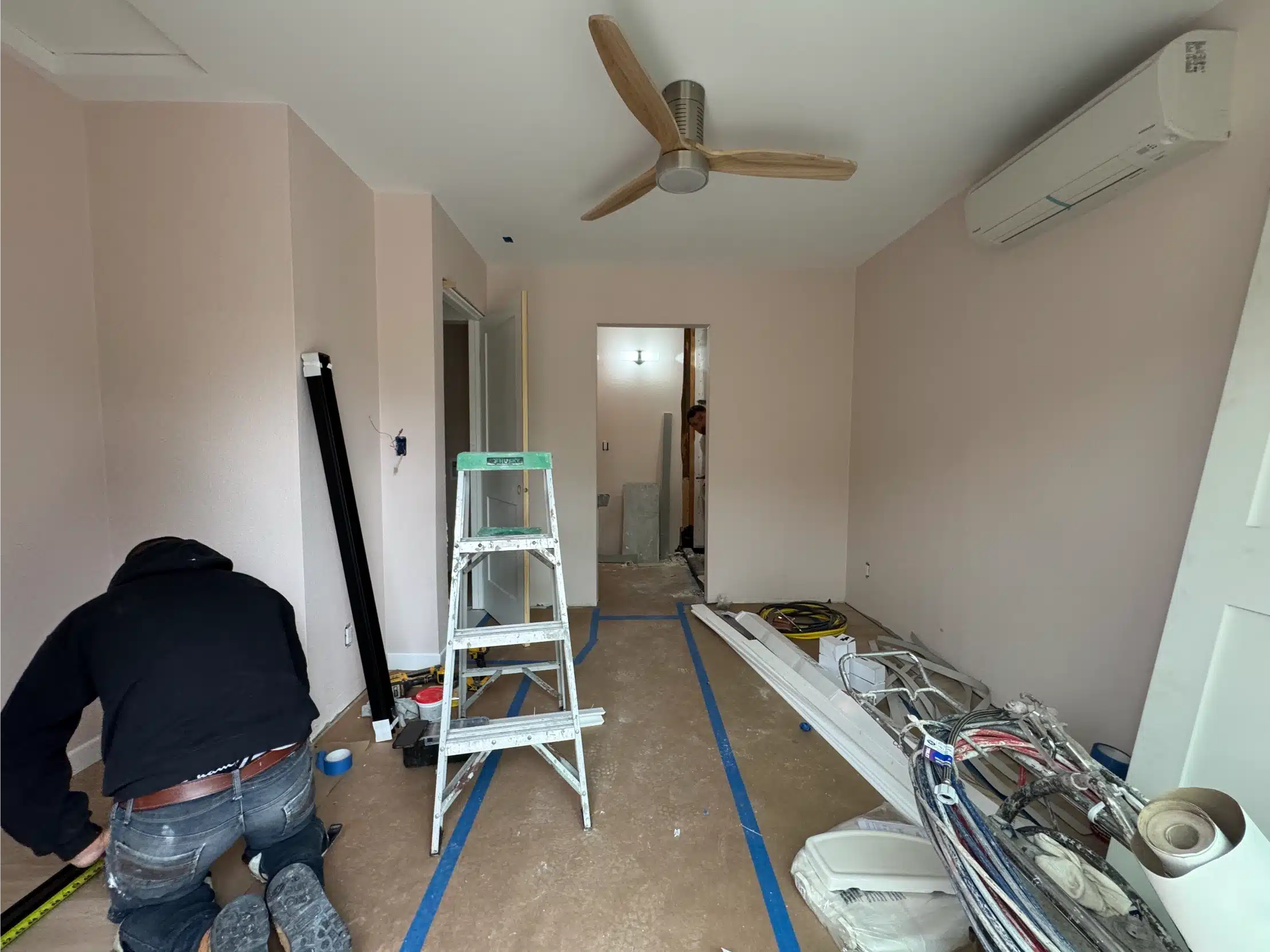 The ADU interior nearing completion with the ceiling fan and mini-split installed
