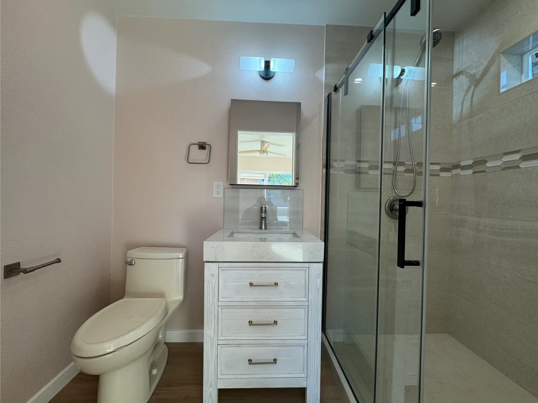 The ADU bathroom from the doorway, showing the vanity and shower