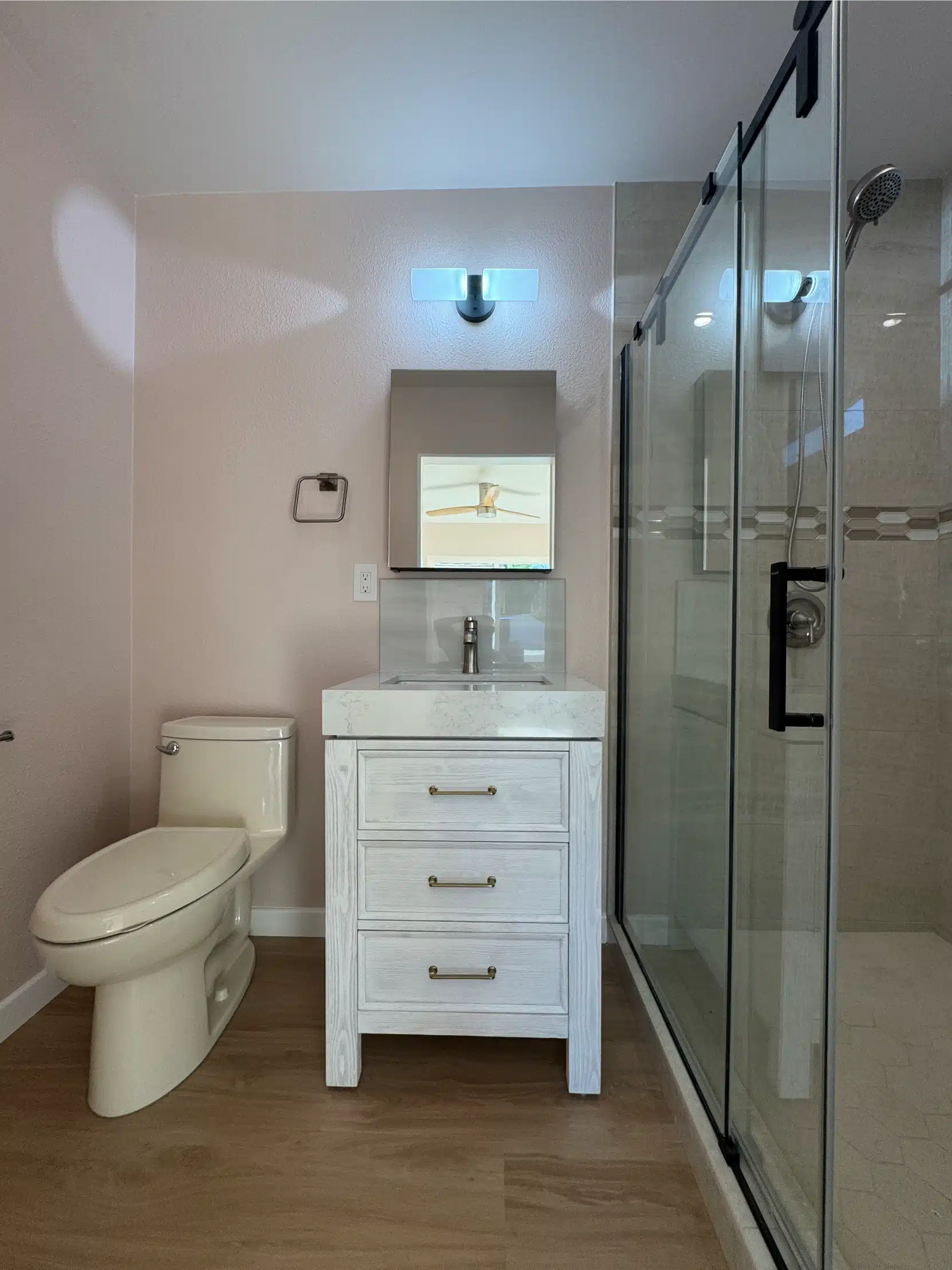 Walk-in shower with frameless glass and full-height tile
