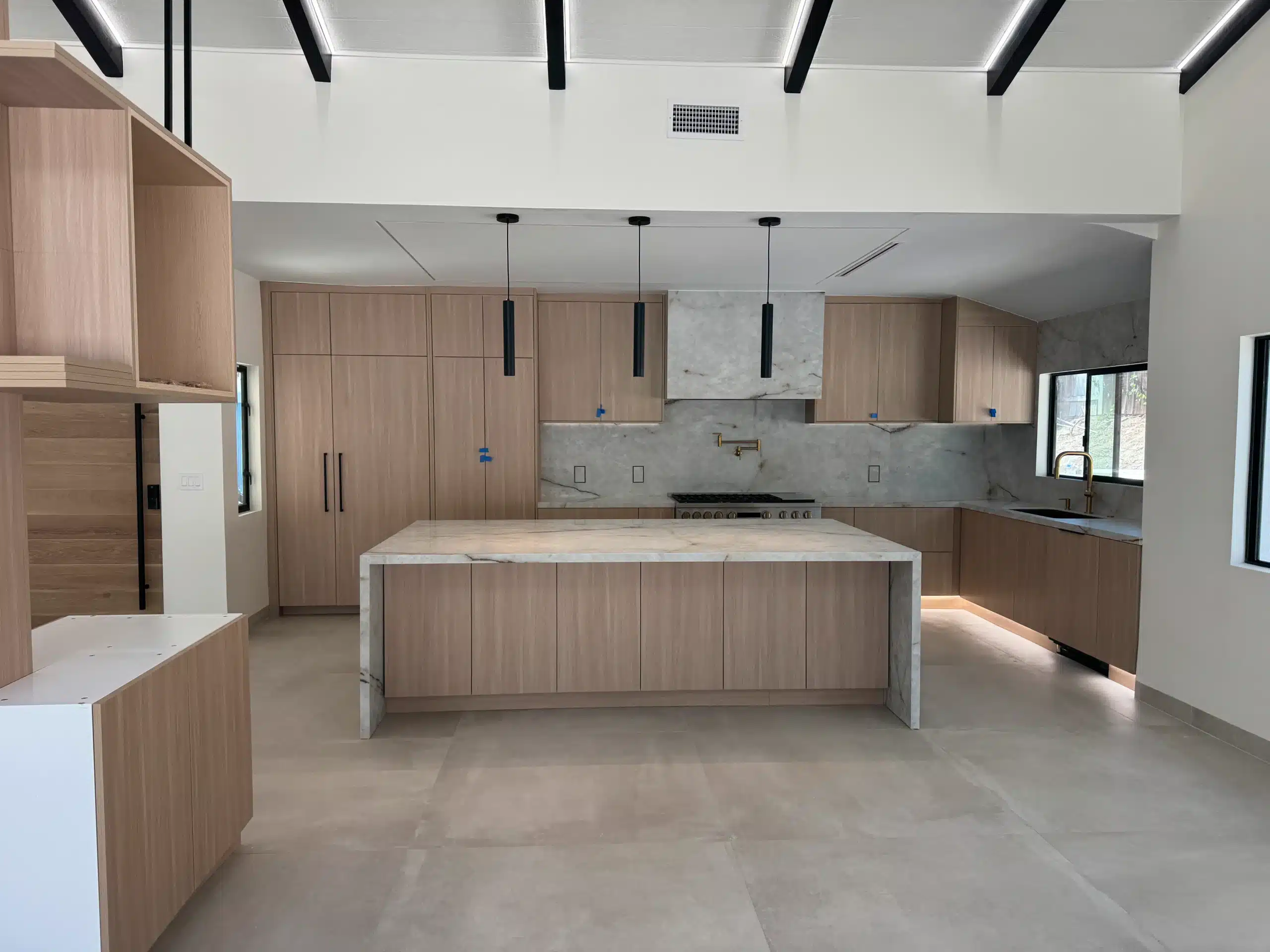 Whole-home remodel in Scripps Ranch with a relocated kitchen and vaulted beamed ceiling