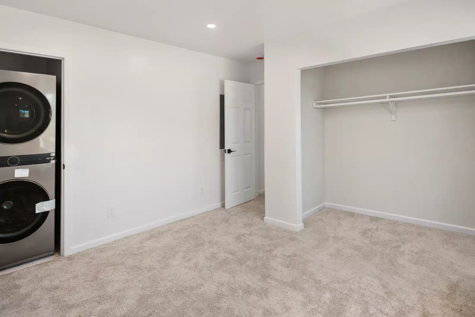 Room with the laundry closet and a built-in clothes closet